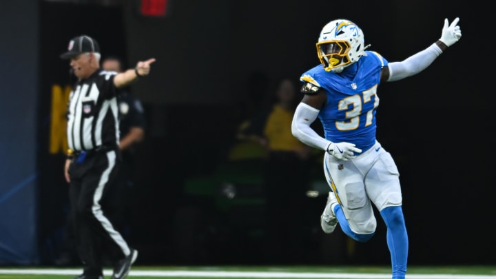 Aug 10, 2024; Inglewood, California, USA; Los Angeles Chargers safety Tony Jefferson (37) scores a touchdown against the Seattle Seahawks during the third quarter at SoFi Stadium. Mandatory Credit: Jonathan Hui-USA TODAY Sports