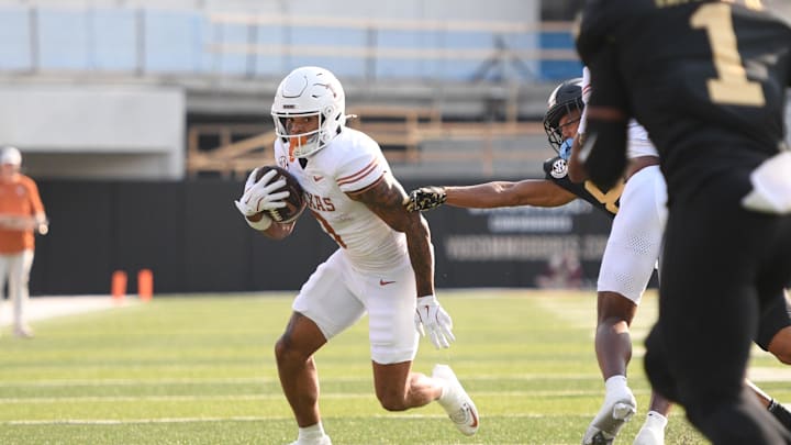 Oct 26, 2024; Nashville, Tennessee, USA;  Texas Longhorns wide receiver DeAndre Moore Jr. (0) runs the ball against the Vanderbilt Commodores during the first half at FirstBank Stadium. Mandatory Credit: Steve Roberts-Imagn Images