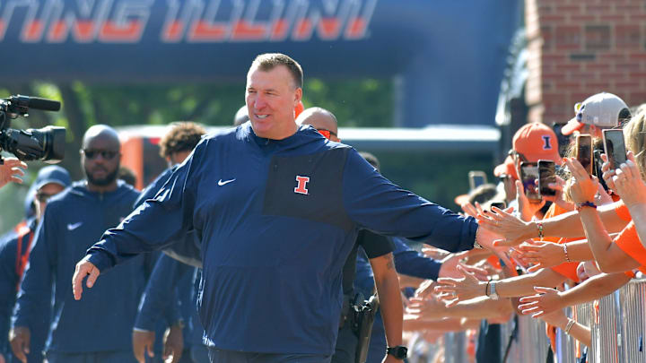 Aug 29, 2025; Champaign, Illinois, USA;  Illinois Fighting Illini head coach Bret Bielema leads his team during the Illini Walk before an NCAA football game against the Western Illinois Leathernecks at Memorial Stadium. Mandatory Credit: Ron Johnson-Imagn Images