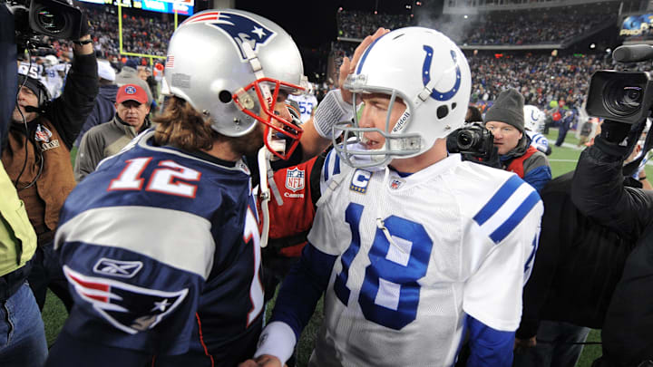 Indianapolis Colts quarterback Peyton Manning, right, meets with New England Patriots quarterback Tom Brady after a game at Gillette Stadium on Nov. 21, 2010. The Colts lost 31-28.