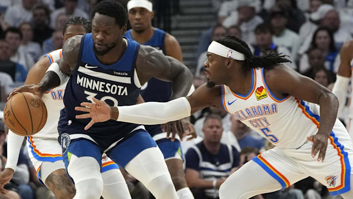 May 26, 2025; Minneapolis, Minnesota, USA; Minnesota Timberwolves forward Julius Randle (30) dribbles the ball against Oklahoma City Thunder guard Luguentz Dort (5) in the first half in game four of the western conference finals for the 2025 NBA Playoffs at Target Center. Mandatory Credit: Bruce Kluckhohn-Imagn Images May 26, 2025; Minneapolis, Minnesota, USA; Minnesota Timberwolves forward Julius Randle (30) dribbles the ball against Oklahoma City Thunder guard Luguentz Dort (5) in the first half in game four of the western conference finals for the 2025 NBA Playoffs at Target Center. Mandatory Credit: Bruce Kluckhohn-Imagn Images