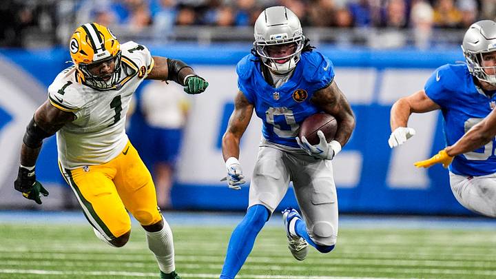 Detroit Lions running back Jahmyr Gibbs (0) runs against Green Bay Packers defensive end Micah Parsons (1) during the first half at Ford Field in Detroit on Thursday, Nov. 27, 2025. Detroit Lions running back Jahmyr Gibbs (0) runs against Green Bay Packers defensive end Micah Parsons (1) during the first half at Ford Field in Detroit on Thursday, Nov. 27, 2025.