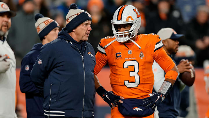Dec 24, 2023; Denver, Colorado, USA; Denver Broncos head coach Sean Payton talks with quarterback Russell Wilson (3) before the game against the New England Patriots at Empower Field at Mile High. Mandatory Credit: Isaiah J. Downing-USA TODAY Sports