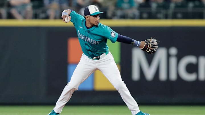 Seattle Mariners second baseman Jorge Polanco (7) throws to first on a play against the Minnesota Twins during the first inning at T-Mobile Park in 2024.