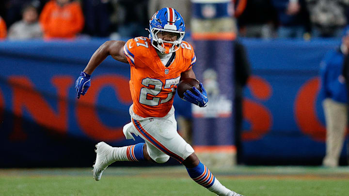 Nov 6, 2025; Denver, Colorado, USA; Denver Broncos running back J.K. Dobbins (27) runs the ball in the fourth quarter against the Las Vegas Raiders at Empower Field at Mile High. 