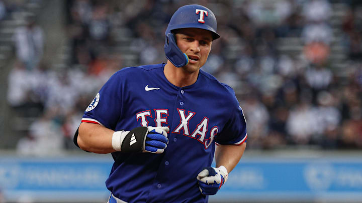 Texas Rangers shortstop Corey Seager rounds the bases after a solo home run against the New York Yankees at Yankee Stadium.