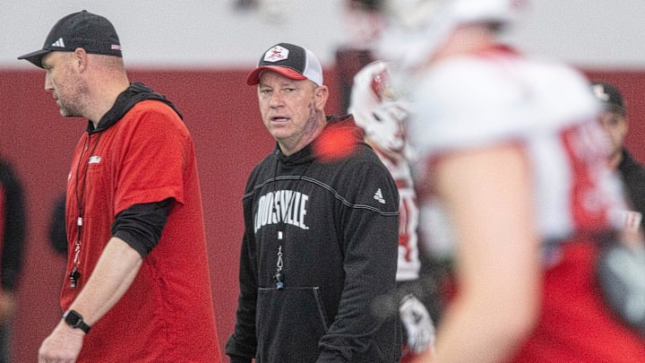 Louisville head football coach Jeff Brohm oversees practice
