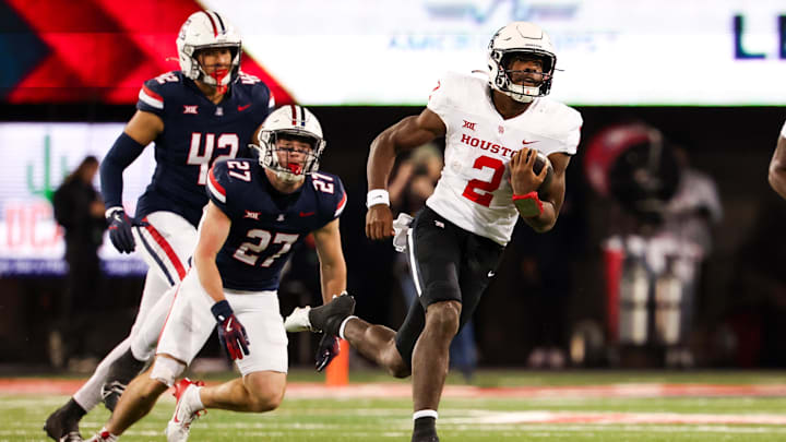 Nov 15, 2024; Tucson, Arizona, USA; Houston Cougars quarterback Zeon Chriss (2) runs with the ball during the third quarter against the Arizona Wildcats at Arizona Stadium. Mandatory Credit: Aryanna Frank-Imagn Images Nov 15, 2024; Tucson, Arizona, USA; Houston Cougars quarterback Zeon Chriss (2) runs with the ball during the third quarter against the Arizona Wildcats at Arizona Stadium. Mandatory Credit: Aryanna Frank-Imagn Images