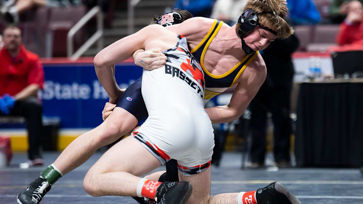 Littlestown's Cameron Mingee (rear) wrestles Bishop McCort's Bo Bassett in the 139-pound championship bout at the PIAA Class 2A Wrestling Championships at the Giant Center on March 9, 2024, in Hershey. Littlestown's Cameron Mingee (rear) wrestles Bishop McCort's Bo Bassett in the 139-pound championship bout at the PIAA Class 2A Wrestling Championships at the Giant Center on March 9, 2024, in Hershey.