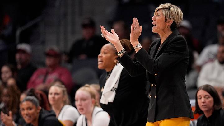 Nov 10, 2024; Charlotte, NC, USA; Iowa Hawkeyes head coach Jan Jensen cheers on her defense during the first half against the Virginia Tech Hokies at Spectrum Center. Mandatory Credit: Jim Dedmon-Imagn Images