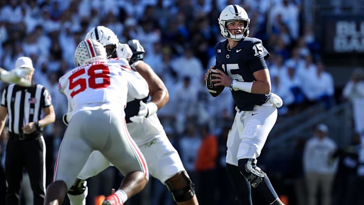 Penn State Nittany Lions quarterback Drew Allar drops back in the pocket while looking to throw a pass during the first quarter against the Ohio State Buckeyes at Beaver Stadium. Penn State Nittany Lions quarterback Drew Allar drops back in the pocket while looking to throw a pass during the first quarter against the Ohio State Buckeyes at Beaver Stadium.