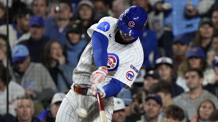 Oct 9, 2025; Chicago, Illinois, USA; Chicago Cubs right fielder Kyle Tucker (30) hits a home run against the Milwaukee Brewers during the seventh inning for game four of the NLDS round for the 2025 MLB playoffs at Wrigley Field. Mandatory Credit: David Banks-Imagn Images
