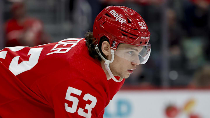 Detroit Red Wings defenseman Moritz Seider (53) gets set before a face-off.