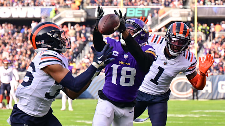 Nov 24, 2024; Chicago, Illinois, USA; Chicago Bears defensive back Jonathan Owens (36) is called for pass interference as he intercepts a pass intended for Minnesota Vikings wide receiver Justin Jefferson (18) during the second quarter at Soldier Field.