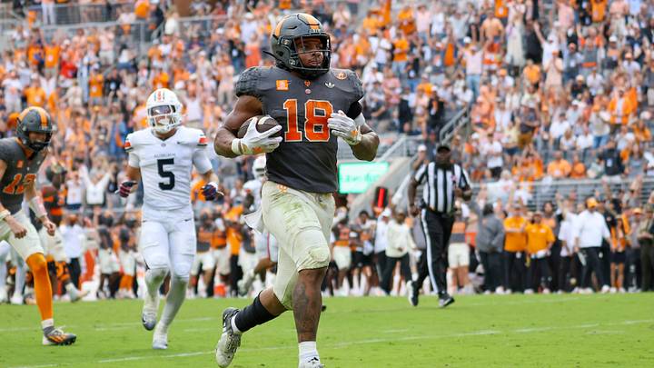 Oct 3, 2026; Knoxville, Tennessee, USA; Tennessee Volunteers running back DeSean Bishop (18) runs for a touchdown against the Auburn Tigers during the second half at Neyland Stadium. Mandatory Credit: Randy Sartin-Imagn Images Oct 3, 2026; Knoxville, Tennessee, USA; Tennessee Volunteers running back DeSean Bishop (18) runs for a touchdown against the Auburn Tigers during the second half at Neyland Stadium. Mandatory Credit: Randy Sartin-Imagn Images