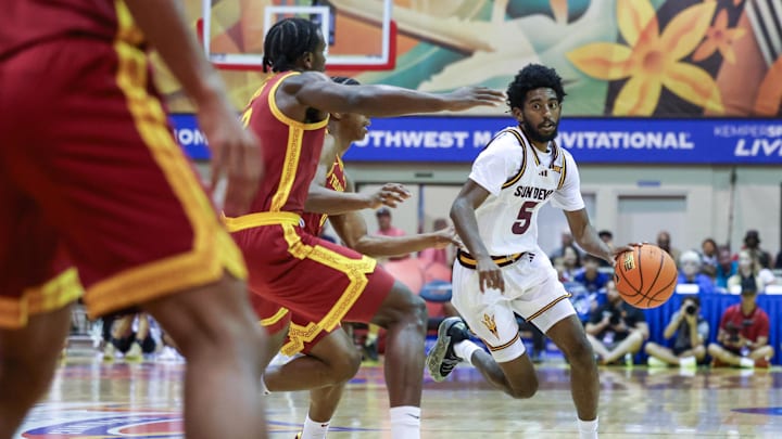 Nov 26, 2025; Lahaina, HI, USA; Arizona State Sun Devils guard Moe Odum (5) tries to get around the USC Trojans defense during the first half of the championship match at Lahaina Civic Center. Mandatory Credit: Marco Garcia-Imagn Images Nov 26, 2025; Lahaina, HI, USA; Arizona State Sun Devils guard Moe Odum (5) tries to get around the USC Trojans defense during the first half of the championship match at Lahaina Civic Center. Mandatory Credit: Marco Garcia-Imagn Images
