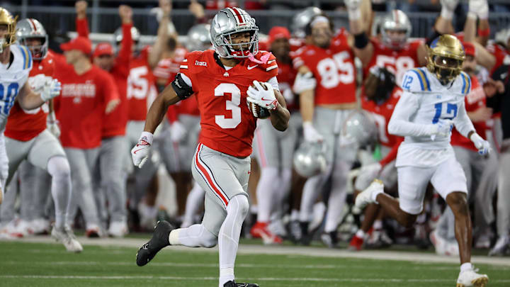 Ohio State Buckeyes cornerback Lorenzo Styles Jr. (3) returns a punt for a touchdown during the third quarter against the UCLA Bruins at Ohio Stadium. Mandatory Credit: Joseph Maiorana-Imagn Images