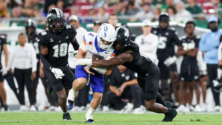 Aug 28, 2025; Tampa, Florida, USA; Boise State Broncos quarterback Maddux Madsen (4) is brought down by South Florida Bulls linebacker Jhalyn Shuler (7) in the third quarter at Raymond James Stadium. Aug 28, 2025; Tampa, Florida, USA; Boise State Broncos quarterback Maddux Madsen (4) is brought down by South Florida Bulls linebacker Jhalyn Shuler (7) in the third quarter at Raymond James Stadium.