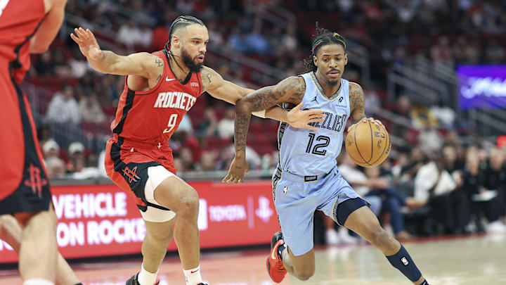 Memphis Grizzlies guard Ja Morant (12) drives with the ball as Houston Rockets forward Dillon Brooks (9) defends during the first quarter at Toyota Center. Mandatory Credit: Troy Taormina-Imagn Images Memphis Grizzlies guard Ja Morant (12) drives with the ball as Houston Rockets forward Dillon Brooks (9) defends during the first quarter at Toyota Center. Mandatory Credit: Troy Taormina-Imagn Images
