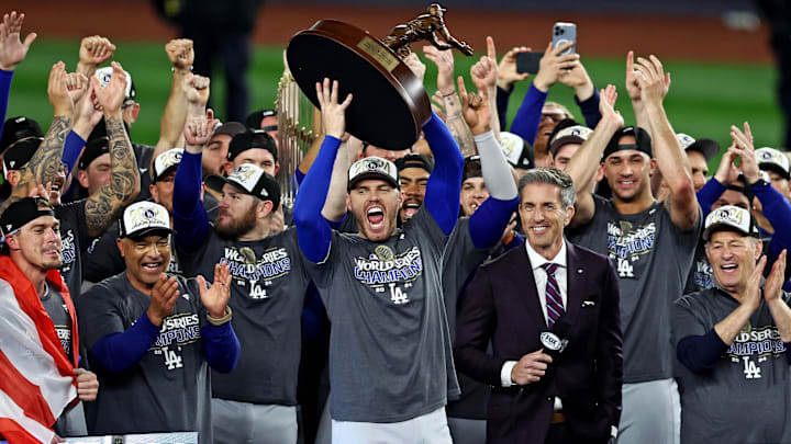 Oct 31, 2024; New York, USA, LAD; Los Angeles Dodgers first baseman Freddie Freeman (5) celebrates with the Willie Mays World Series Most Valuable Player Award after being name the MVP in game five to win the 2024 Imagn Images World Series against the New York Yankees at New York. Mandatory Credit: Wendell Cruz-Imagn Images