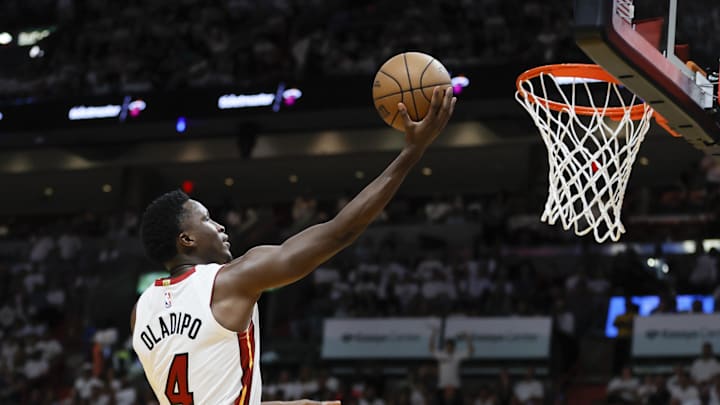 Apr 22, 2023; Miami, Florida, USA; Miami Heat guard Victor Oladipo (4) drives to the basket in the fourth quarter against the Milwaukee Bucks during game three of the 2023 NBA Playoffs at Kaseya Center. Mandatory Credit: Sam Navarro-Imagn Images