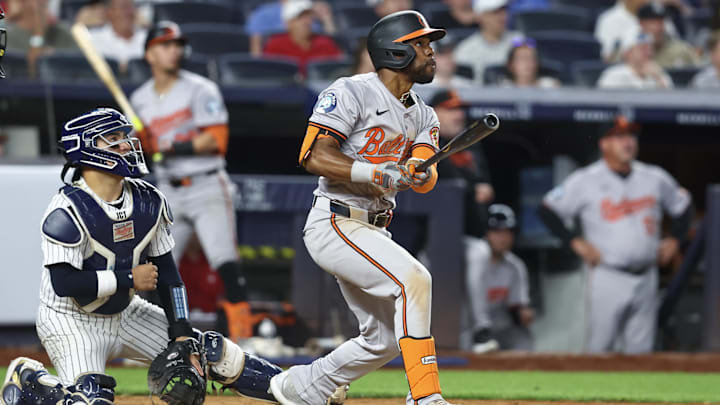 Jun 19, 2024; Bronx, New York, USA;  Baltimore Orioles center fielder Cedric Mullins (31) hits an RBI single in the tenth inning against the New York Yankees at Yankee Stadium.