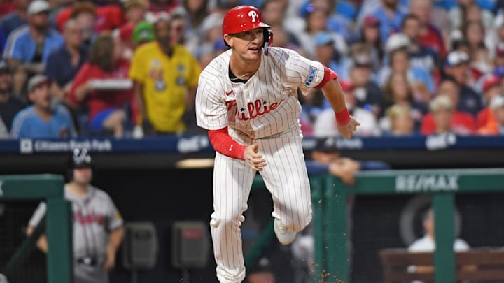 Aug 31, 2024; Philadelphia, Pennsylvania, USA; Philadelphia Phillies outfielder Austin Hays (9) hits a double during the second inning against the Atlanta Braves at Citizens Bank Park.