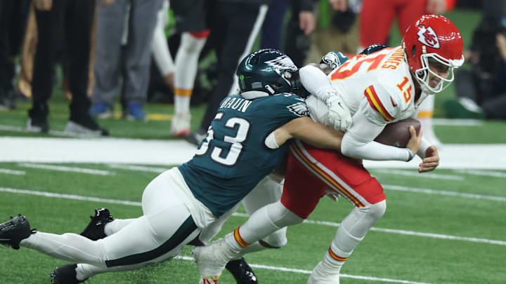Feb 9, 2025; New Orleans, LA, USA;  Kansas City Chiefs quarterback Patrick Mahomes (15) is tackled by Philadelphia Eagles linebacker Zack Baun (53) in Super Bowl LIX between the Philadelphia Eagles and the Kansas City Chiefs at Ceasars Superdome. Mandatory Credit: Stephen Lew-Imagn Images