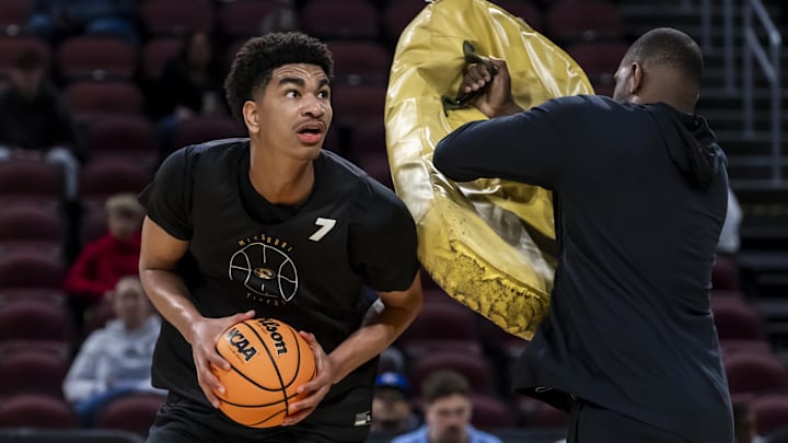 Mar 19, 2025; Wichita, KS, USA; Missouri Tigers center Trent Burns (7) maneuvers around a trainer during a practice session at Intrust Bank Arena. Mandatory Credit: Nick Tre. Smith-Imagn Images Mar 19, 2025; Wichita, KS, USA; Missouri Tigers center Trent Burns (7) maneuvers around a trainer during a practice session at Intrust Bank Arena. Mandatory Credit: Nick Tre. Smith-Imagn Images