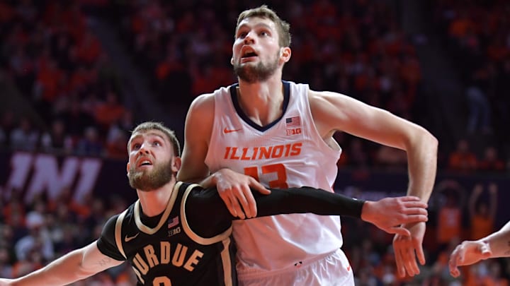 Mar 7, 2025; Champaign, Illinois, USA;  Purdue Boilermakers guard Braden Smith (3) and Illinois Fighting Illini center Tomislav Ivisic (13) battle for position during the first half at State Farm Center. Mandatory Credit: Ron Johnson-Imagn Images