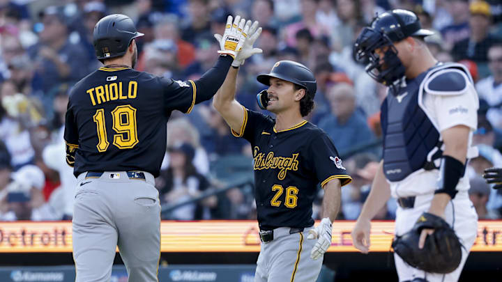Jun 19, 2025; Detroit, Michigan, USA;  Pittsburgh Pirates shortstop Jared Triolo (19) receives congratulations from outfielder Adam Frazier (26)  after he hits a two run home run in the second inning against the Detroit Tigers at Comerica Park. Mandatory Credit: Rick Osentoski-Imagn Images