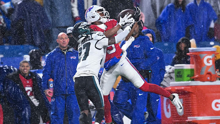 Buffalo Bills wide receiver Joshua Palmer (5) catches a pass as Philadelphia Eagles cornerback Quinyon Mitchell (27) defends in the third quarter at Highmark Stadium.
