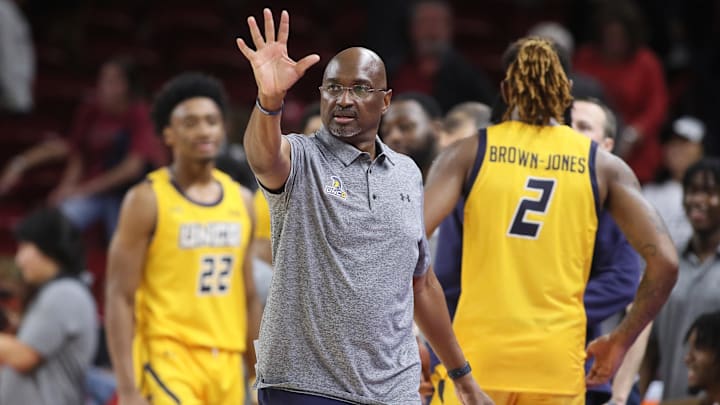 UNC Greensboro coach Mike Jones against Arkansas at Bud Walton Arena. 