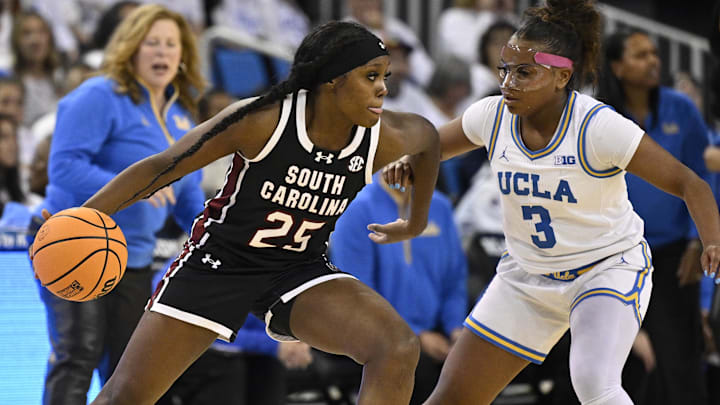Nov 24, 2024; Los Angeles, California, USA; South Carolina Gamecocks guard Raven Johnson (25) is defending dad by UCLA Bruins guard Londynn Jones (3) during the first quarter at Pauley Pavilion presented by Wescom. Mandatory Credit: Robert Hanashiro-Imagn Images