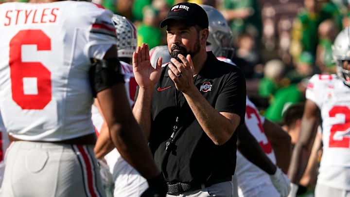 Ohio State Buckeyes head coach Ryan Day leads warm ups prior to the College Football Playoff quarterfinal against the Oregon Ducks at the Rose Bowl in Pasadena, Calif. on Jan. 1, 2025.