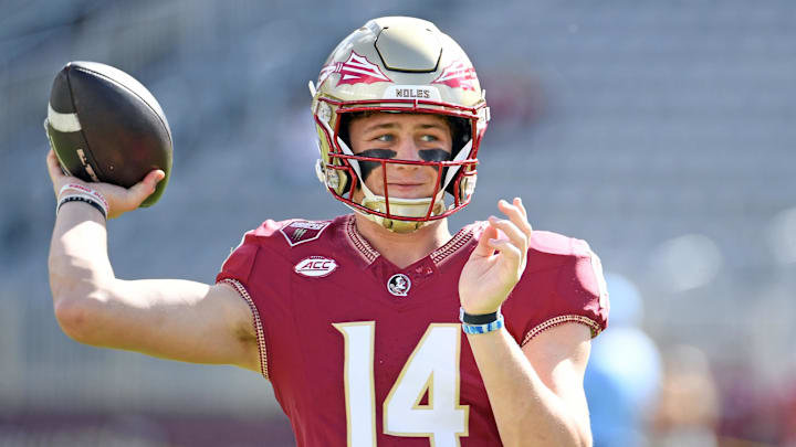 Nov 2, 2024; Tallahassee, Florida, USA;  Florida State Seminoles quarterback Luke Kromenhoek (14) warms up before a game against the North Carolina Tarheels at Doak S. Campbell Stadium. Mandatory Credit: Robert Myers-Imagn Images