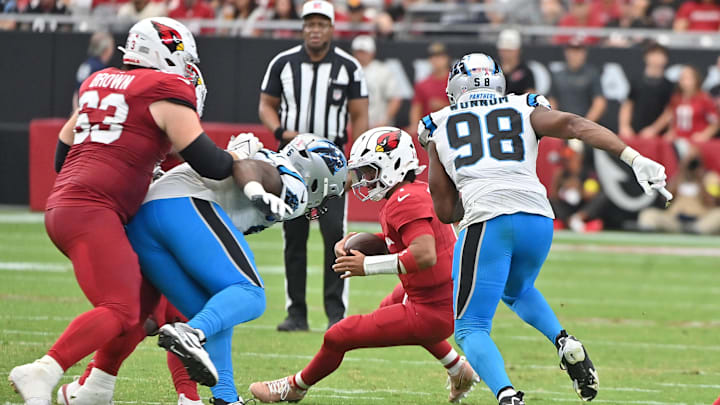 Sep 14, 2025; Glendale, Arizona, USA;  Carolina Panthers linebacker D.J. Wonnum (98) sacks Arizona Cardinals quarterback Kyler Murray (1) during the fourth quarter at State Farm Stadium. Mandatory Credit: Matt Kartozian-Imagn Images