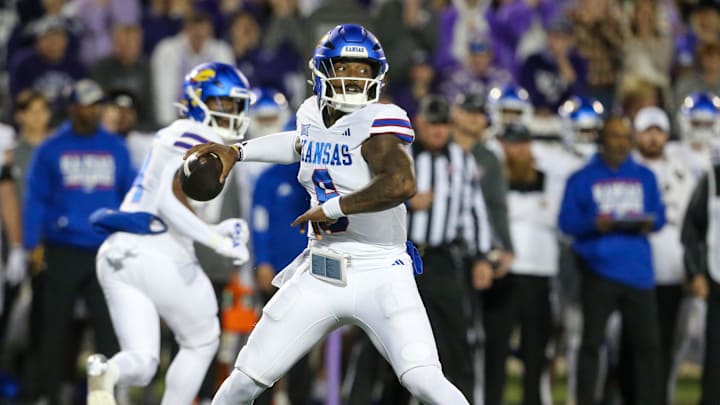 Oct 26, 2024; Manhattan, Kansas, USA; Kansas Jayhawks quarterback Jalon Daniels (6) drops back to pass during the first quarter against the Kansas State Wildcats at Bill Snyder Family Football Stadium. Mandatory Credit: Scott Sewell-Imagn Images