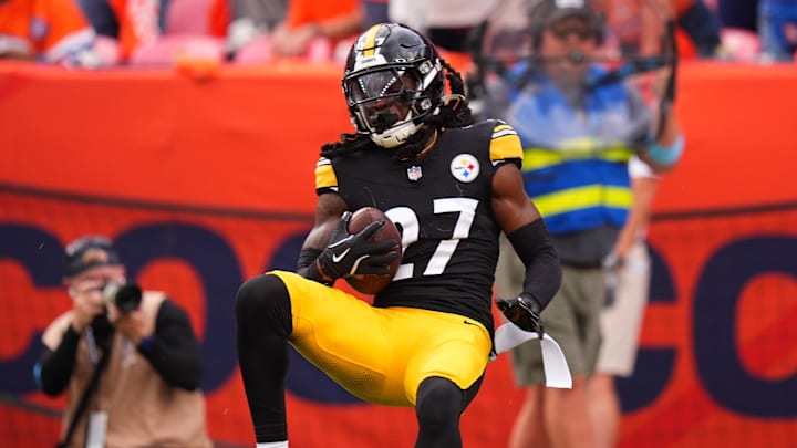 Sep 15, 2024; Denver, Colorado, USA; Pittsburgh Steelers cornerback Cory Trice Jr. (27) intercepts the ball in the fourth quarter against the Denver Broncos at Empower Field at Mile High. Mandatory Credit: Ron Chenoy-Imagn Images