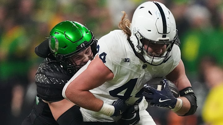 Bryce Boettcher corrals Penn State's Tyler Warren in the Big Ten Championship. To return there, the Ducks have to take it game by game