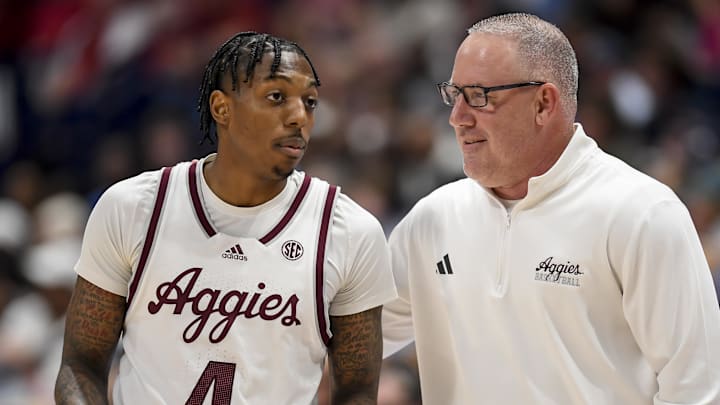 Mar 14, 2024; Nashville, TN, USA; Texas A&M Aggies head coach Buzz Williams talks with guard Wade Taylor IV (4) against the Mississippi Rebels during the second half at Bridgestone Arena.