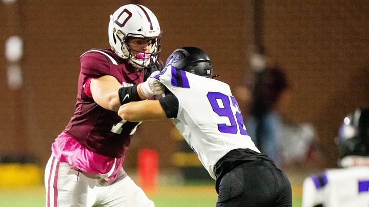 Dowling Catholic’s Carter Barrett (77) blocks during a game against Waukee on Oct. 10, 2025, at Valley Stadium in West Des Moines.