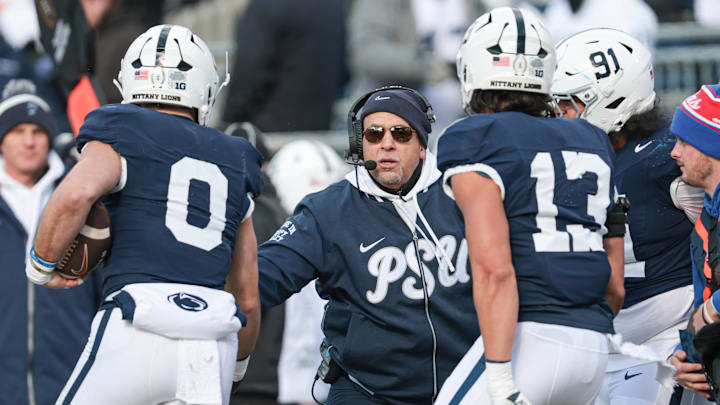 Penn State Nittany Lions head coach James Franklin celebrates with linebacker Dominic DeLuca (0) after an interception for  a touchdown during the first half against the SMU Mustangs at Beaver Stadium.