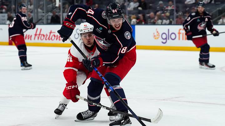 Sep 21, 2026; Columbus, Ohio, USA; Columbus Blue Jackets defenseman Guillaume Richard (56) skates with the puck against Detroit Red Wings forward Carter Berar (41) in the third period at Nationwide Arena. Mandatory Credit: Aaron Doster-Imagn Images Sep 21, 2026; Columbus, Ohio, USA; Columbus Blue Jackets defenseman Guillaume Richard (56) skates with the puck against Detroit Red Wings forward Carter Berar (41) in the third period at Nationwide Arena. Mandatory Credit: Aaron Doster-Imagn Images