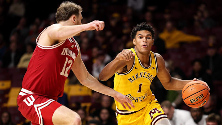 Minnesota guard Isaac Asuma works around Indiana forward Tucker DeVries on Dec. 3, 2025, in the first half at Williams Arena. Minnesota guard Isaac Asuma works around Indiana forward Tucker DeVries on Dec. 3, 2025, in the first half at Williams Arena.