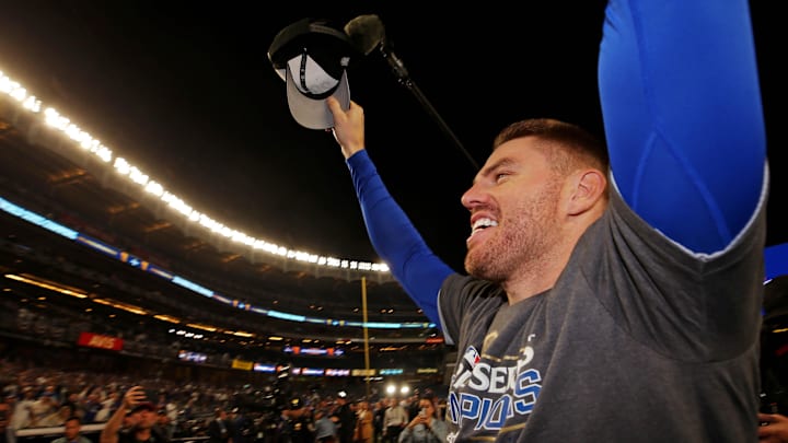 Oct 31, 2024; New York, New York, USA; Los Angeles Dodgers first baseman Freddie Freeman (5) celebrates after the Los Angeles Dodgers beat the New York Yankees in game four to win the 2024 MLB World Series at Yankee Stadium. Mandatory Credit: Brad Penner-Imagn Images