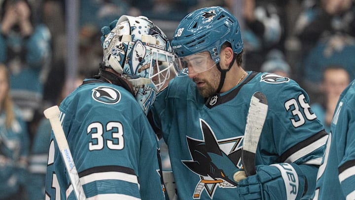 Jan 23, 2026; San Jose, California, USA;  San Jose Sharks defenseman Mario Ferraro (38) celebrates with San Jose Sharks goaltender Alex Nedeljkovic (33) after defeating the New York Rangers at SAP Center at San Jose. Mandatory Credit: Stan Szeto-Imagn Images