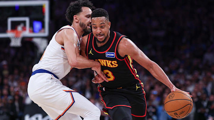 Atlanta Hawks guard CJ McCollum (3) dribbles as New York Knicks guard Landry Shamet (44) defends during the second half of the 2026 NBA Playoffs at Madison Square Garden.
