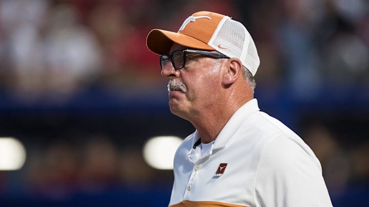 Texas Longhorns head coach Mike White walks out to the coaches box in the sixth inning. Texas Longhorns head coach Mike White walks out to the coaches box in the sixth inning.