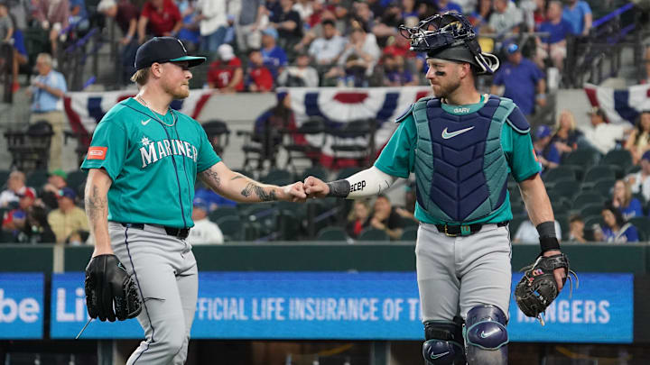 Gabe Speier (55) and catcher Mitch Garver (18) fist bump after retiring the Texas Rangers in the eighth inning.